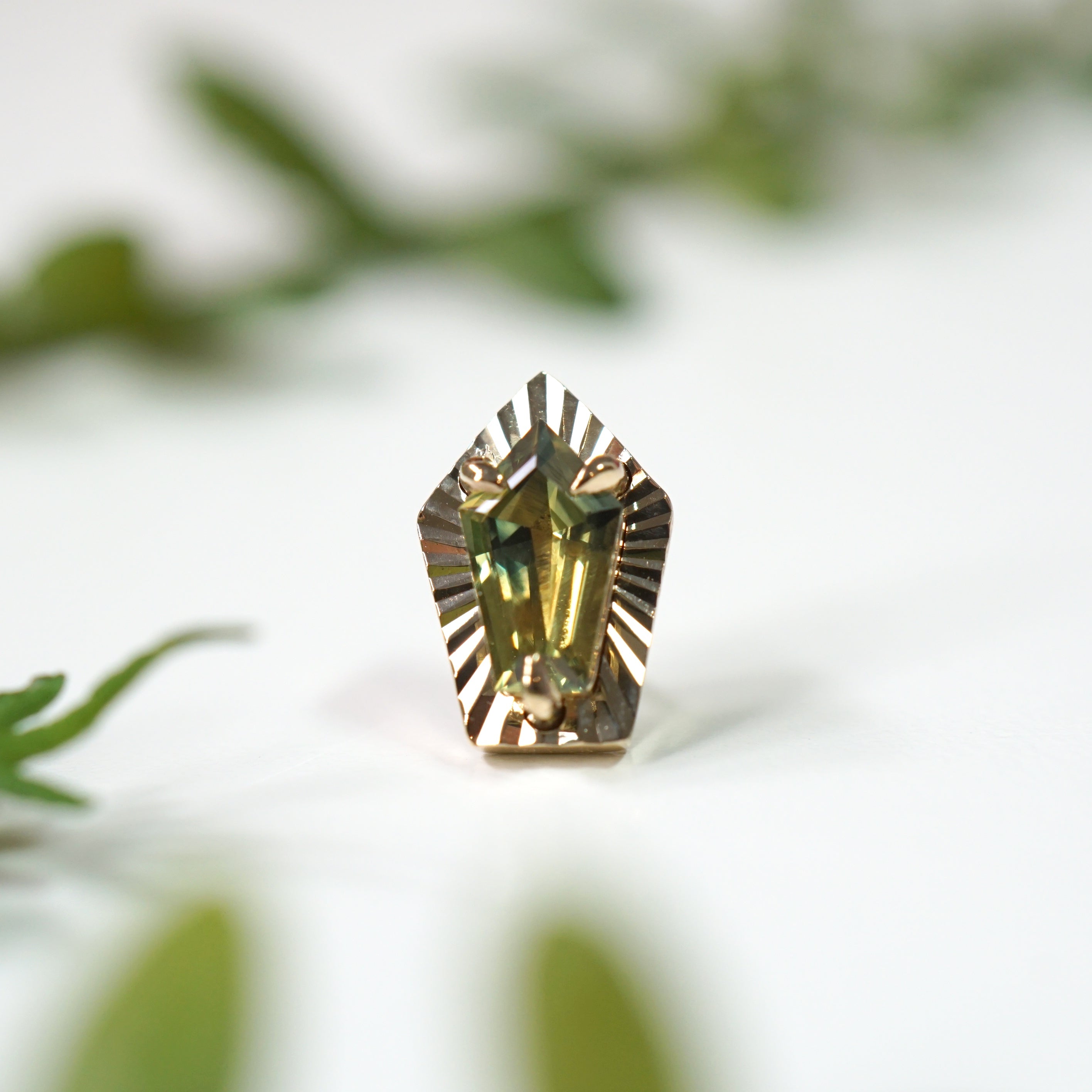 Greenish Blue Sapphire with Ray Gold Edge