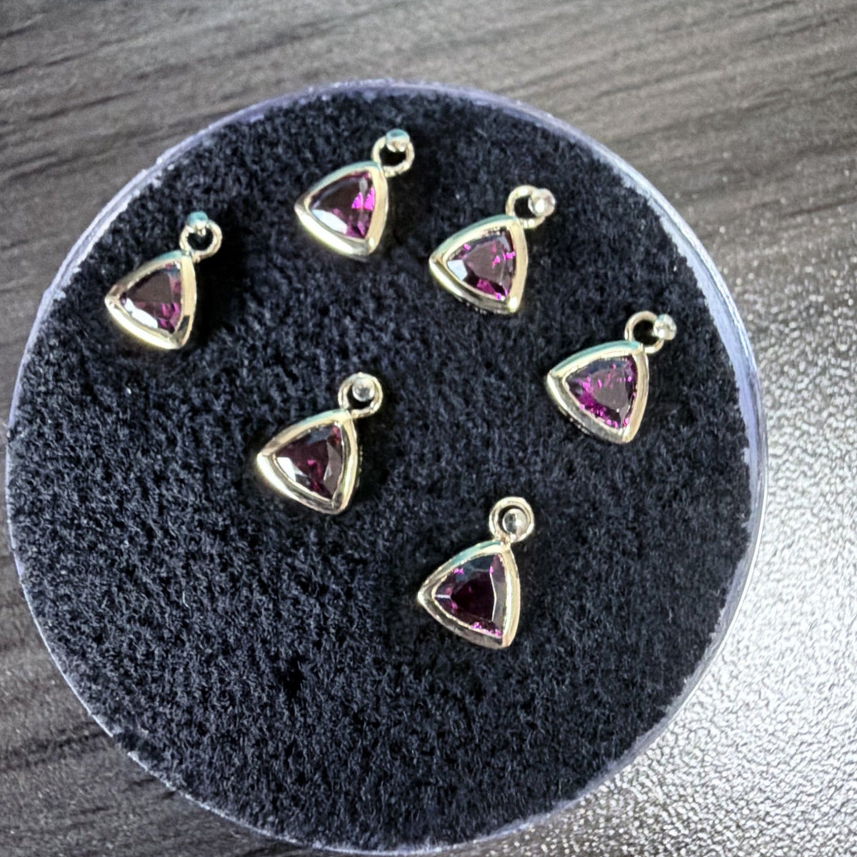 Bezel-set trillion rhodolite garnet charms with jump rings