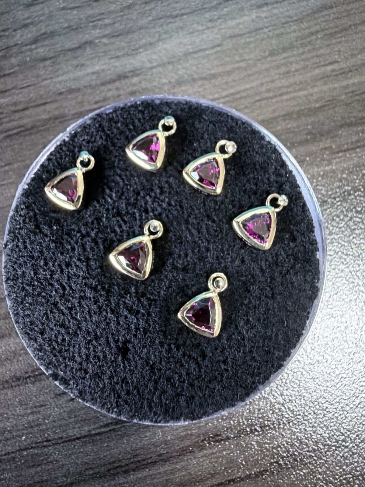 Bezel-set trillion rhodolite garnet charms with jump rings